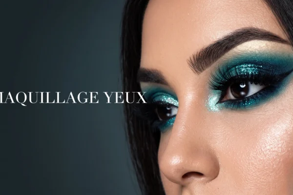 Gros plan sur un maquillage des yeux bleu vert éclatant pour un look éditorial.